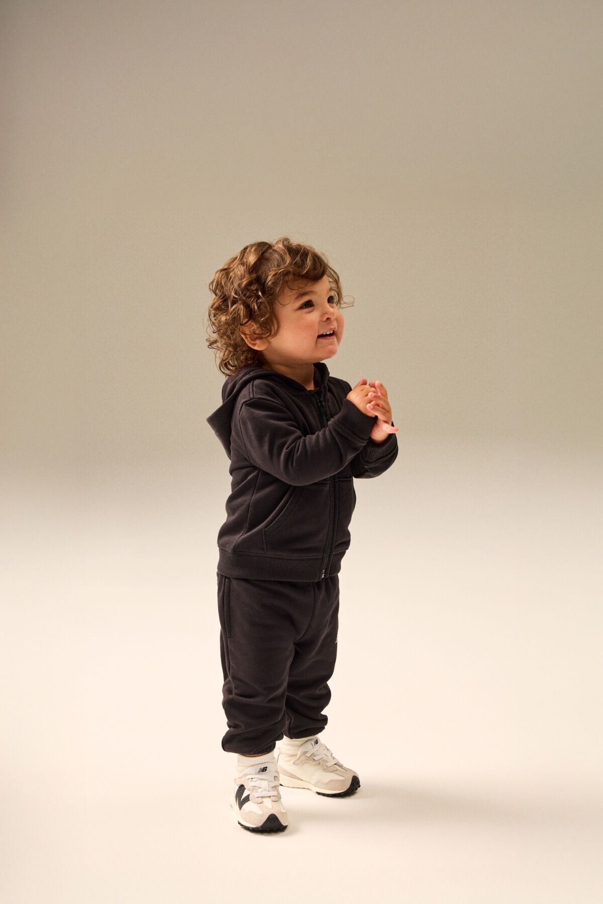 Small child standing in a matching clothing set